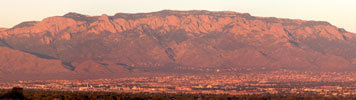 Panoramic view of the Sandia Mountains at sunset