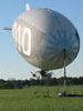 Izod Blimp, also operated by The Lightship Group, on the mast at Solberg Airport